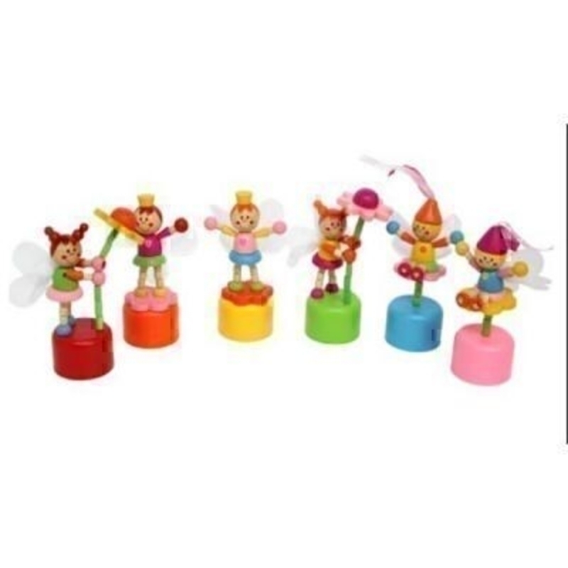 Choice of 6 Wooden Push Up Fairy Toy by Gisela Graham. Wooden Push up toys in 6 different fairy designs. Brightly coloured painted wood with net wings. If preference please specify choice by colour of the base - blue, green, orange, red, pink, or yello